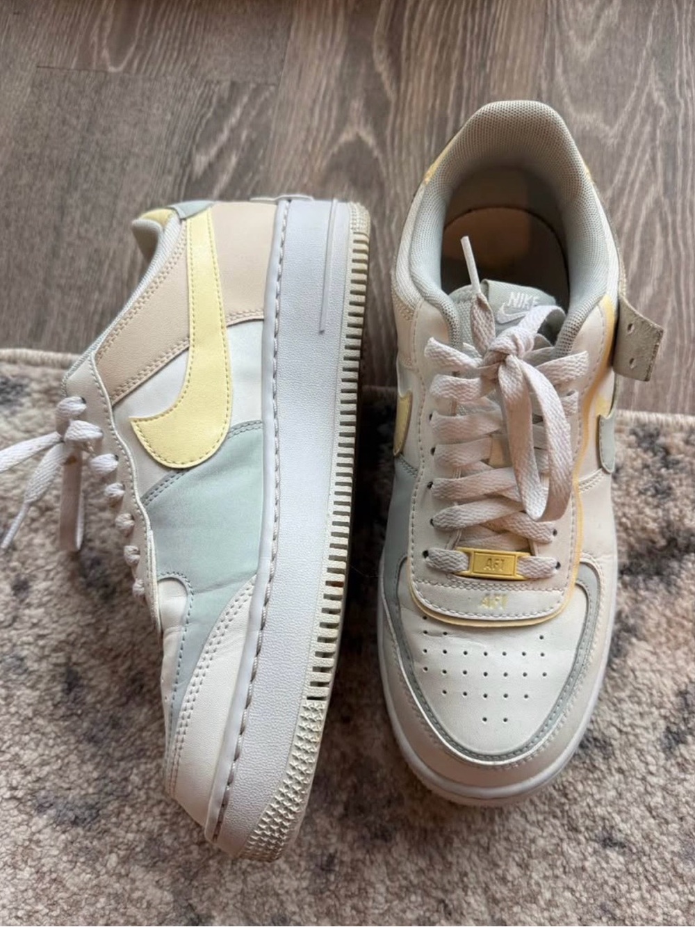 Nike Women's Low Top Sneakers in Pastel Yellow, Cream, Pale Blue
